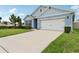 Inviting home showcasing manicured landscaping and a pristine driveway at 585 Talisi Loop, St Cloud, FL 34771