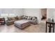 Comfortable living room featuring a large sectional sofa, neutral tones, and ample natural light at 585 Talisi Loop, St Cloud, FL 34771