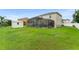 Large backyard with pool, shed, and lush green lawn offers outdoor enjoyment at 605 Elbridge Dr, Kissimmee, FL 34758