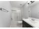 Bathroom featuring a shower-tub combo with subway tile and a dark wood vanity at 605 Elbridge Dr, Kissimmee, FL 34758