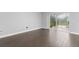 Bedroom with tile floors and sliding glass door access to the outdoors at 605 Elbridge Dr, Kissimmee, FL 34758