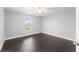 Bedroom featuring hardwood floors, a ceiling fan and a window with natural light at 605 Elbridge Dr, Kissimmee, FL 34758