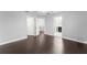 Bedroom features hardwood floors and access to bathroom and walk-in closet at 605 Elbridge Dr, Kissimmee, FL 34758