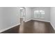 Bright dining area with hardwood floors, arched doorway, and neutral wall paint at 605 Elbridge Dr, Kissimmee, FL 34758
