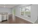 Bright, modern kitchen with stainless steel appliances and a view to the pool at 605 Elbridge Dr, Kissimmee, FL 34758