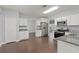 Bright kitchen features stainless steel appliances and granite countertops at 605 Elbridge Dr, Kissimmee, FL 34758
