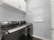 Laundry room with front loading washer and dryer, and window at 605 Elbridge Dr, Kissimmee, FL 34758