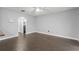 Open living room features modern ceiling fan and neutral paint at 605 Elbridge Dr, Kissimmee, FL 34758