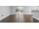 Living room with a sliding glass door overlooking the pool at 605 Elbridge Dr, Kissimmee, FL 34758