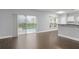 Open living room with sliding glass door and eat-in kitchen at 605 Elbridge Dr, Kissimmee, FL 34758