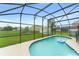 Screened-in pool with in-pool float provides an oasis in a spacious backyard at 605 Elbridge Dr, Kissimmee, FL 34758