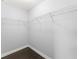 Walk-in closet with hardwood floor and built-in shelving at 605 Elbridge Dr, Kissimmee, FL 34758