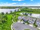 Aerial view showcasing the home's location near a lake and park, with a cul-de-sac street at 6905 Cucamelon Ct, Windermere, FL 34786