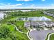 Beautiful aerial view of homes, pond, and walkways in a well-maintained community at 6905 Cucamelon Ct, Windermere, FL 34786