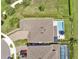 Stunning aerial view of the backyard with a pristine pool and lush landscaping at 6905 Cucamelon Ct, Windermere, FL 34786