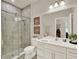 Sleek bathroom with glass shower, white vanity, modern fixtures, and clean lines for a spa-like experience at 6905 Cucamelon Ct, Windermere, FL 34786