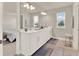 Bright bathroom with double vanity, large mirror, and ample lighting at 6905 Cucamelon Ct, Windermere, FL 34786