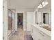 Modern bathroom featuring a glass shower, and dual sink vanity at 6905 Cucamelon Ct, Windermere, FL 34786