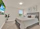Inviting bedroom featuring a queen bed, soft lighting, and relaxing decor creating a comfortable atmosphere at 6905 Cucamelon Ct, Windermere, FL 34786