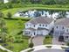 Beautiful two-story home with a pond view, landscaped yard, and a two-car garage at 6905 Cucamelon Ct, Windermere, FL 34786