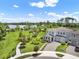 Desirable two-story home with lush green lawns and scenic lake views at 6905 Cucamelon Ct, Windermere, FL 34786