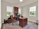 Functional home office with a built-in desk, classic wood finishes, and natural light perfect for productivity at 6905 Cucamelon Ct, Windermere, FL 34786