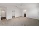 Bright bedroom with vaulted ceiling, neutral carpet, and en-suite bathroom, offering comfort and privacy at 744 Barron Pl, The Villages, FL 32163