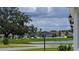 Scenic community view showcasing a pond and well-maintained landscaping at 744 Barron Pl, The Villages, FL 32163