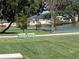 Scenic view of the community with a picturesque pond and well-maintained landscaping at 744 Barron Pl, The Villages, FL 32163