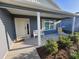 Inviting front porch with seating, offering a relaxing outdoor space to enjoy the neighborhood views at 744 Barron Pl, The Villages, FL 32163