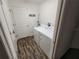 Functional laundry room with washer, dryer, and door to the outside at 744 Barron Pl, The Villages, FL 32163