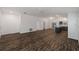 Expansive living room with hardwood floors, natural light, and open space perfect for entertaining and relaxation at 744 Barron Pl, The Villages, FL 32163