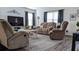 Cozy living room featuring comfortable seating, a neutral color palette, and natural light from the windows at 744 Barron Pl, The Villages, FL 32163