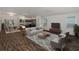 Bright living room showcasing dining and kitchen areas, perfect for relaxation and gatherings at 744 Barron Pl, The Villages, FL 32163