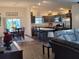 Open-concept living space flows into the dining and kitchen areas, ideal for entertaining at 744 Barron Pl, The Villages, FL 32163