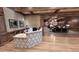 Welcoming lobby featuring a reception desk, wood accents, and a comfortable lounge area at 744 Barron Pl, The Villages, FL 32163