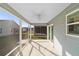 Screened in patio area with overhead fan and natural light at 744 Barron Pl, The Villages, FL 32163