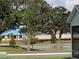 Scenic pond view with mature landscaping offers serenity and privacy at 744 Barron Pl, The Villages, FL 32163