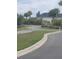 Scenic street view showcases landscaping and a peaceful community at 744 Barron Pl, The Villages, FL 32163