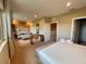 Bedroom with a sitting area, desk, and a walk-in closet with neutral walls at 7528 Brooklyn Dr, Kissimmee, FL 34747