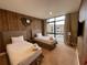 Inviting bedroom with two beds, large window, and wooden accent wall at 7528 Brooklyn Dr, Kissimmee, FL 34747