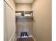 Functional closet with storage shelves, ideal for organizing clothes and personal items at 7528 Brooklyn Dr, Kissimmee, FL 34747