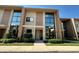 Modern two-story townhome featuring large windows and manicured landscaping in a desirable community at 7528 Brooklyn Dr, Kissimmee, FL 34747