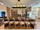 Stylish kitchen with a large central island and modern lighting fixture at 7528 Brooklyn Dr, Kissimmee, FL 34747
