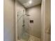 Modern bathroom featuring a glass-enclosed shower with sleek fixtures and a built-in niche at 7528 Brooklyn Dr, Kissimmee, FL 34747