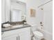 Bathroom with a tub, shower combo, single sink, and white cabinets at 9175 Sommerset Hills Dr, Davenport, FL 33896