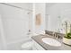 Bathroom with a tub, shower combo, a single sink, and white cabinets at 9175 Sommerset Hills Dr, Davenport, FL 33896