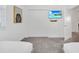 Cozy bedroom with a decorative painting, wall-mounted TV, and a spacious closet at 9175 Sommerset Hills Dr, Davenport, FL 33896