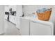 Convenient laundry area with a washer, dryer, and additional storage space at 9175 Sommerset Hills Dr, Davenport, FL 33896