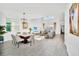 Open-concept living area with high ceilings, comfortable seating, modern furnishings, and lots of natural light at 9175 Sommerset Hills Dr, Davenport, FL 33896